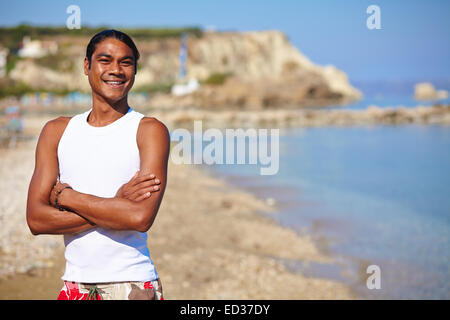 Happy young man having rest by the seaside Stock Photo