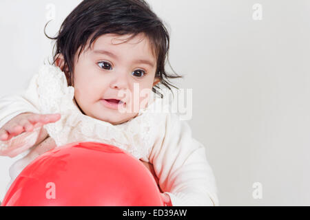 1 indian child Baby playing  toy ball Stock Photo