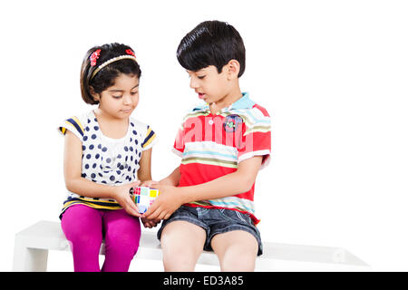 2 indian child friend Playing Puzzle Stock Photo