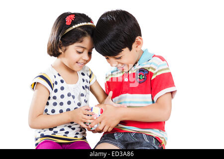 2 indian child friend Playing Puzzle Stock Photo