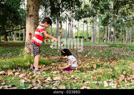 2 indian child  park sitting enjoy Stock Photo