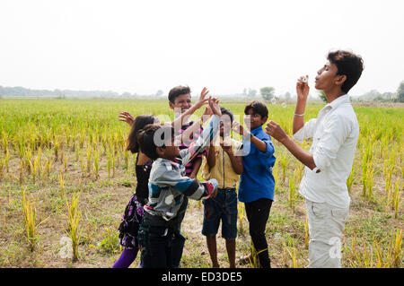 indian rural children farm playing Bubble Wand Stock Photo