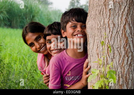indian rural children farm playing Hide and Seek Stock Photo