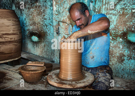 Potter working in the city of Meybod, Province of Yazd, Iran Stock Photo