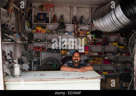 1 indian rural man Cycle Tyre shop Stock Photo