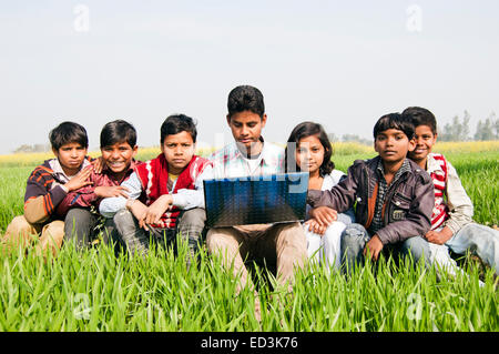 indian rural Children Group field laptop enjoy Stock Photo