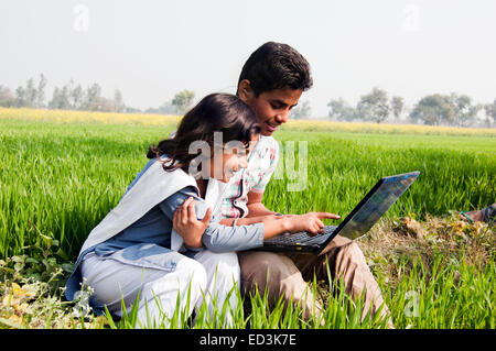 2 indian rural child Field laptop working Stock Photo