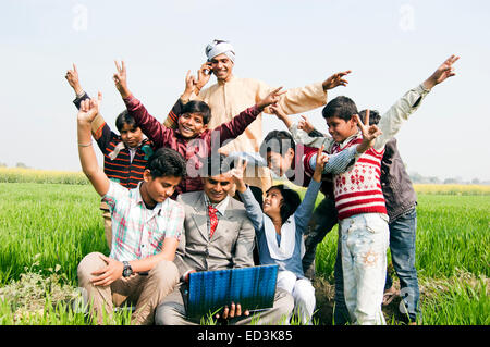 indian rural  Farmer family with Business Man laptop working Stock Photo