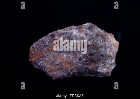 Rare earth element bearing minerals, Bastnesite,(Y), red, Allanite,black, Snowflake mine, Teller county, Colorado Stock Photo