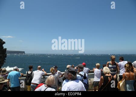 Sydney, Australia. 26 December 2014. Yachts in the 2014 Sydney to Hobart yacht race make their way down the east coast of Australia towards Hobart after leaving the Sydney heads, viewed from Watson’s Bay. Copyright Credit:  2014 Richard Milnes / Alamy Live News Stock Photo