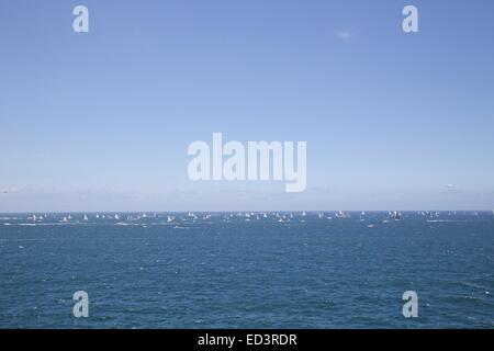 Sydney, Australia. 26 December 2014. Yachts in the 2014 Sydney to Hobart yacht race make their way down the east coast of Australia towards Hobart after leaving the Sydney heads, viewed from Watson’s Bay. Copyright Credit:  2014 Richard Milnes / Alamy Live News Stock Photo