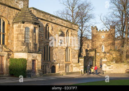 Visitors looking at Durham University Library and castle gatehouse from Palace Green, Durham City north east England, UK Stock Photo