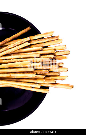 pile of pretzel sticks on white background. Stock Photo