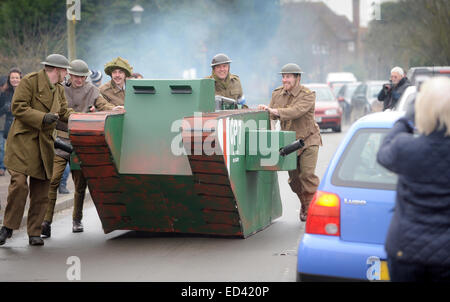 Lewes, UK. 26th Dec, 2014. Villagers competing in their annual Boxing Day Pram Race between the pubs in East Hoathly near Lewes East Sussex. A team with their WW1 tank and uniforms. Credit:  Jim Holden/Alamy Live News Stock Photo
