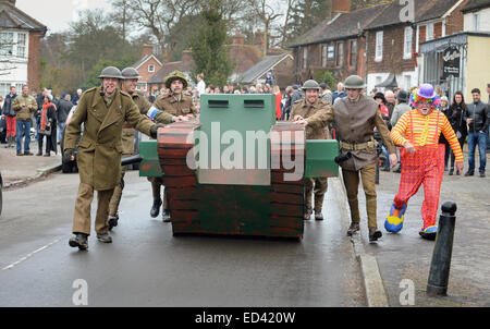 Lewes, UK. 26th Dec, 2014. Villagers competing in their annual Boxing Day Pram Race between the pubs in East Hoathly near Lewes East Sussex. A team with their WW1 tank and uniforms. Credit:  Jim Holden/Alamy Live News Stock Photo