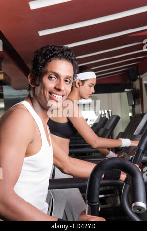 2 indian sports person tread Mill  Running Stock Photo