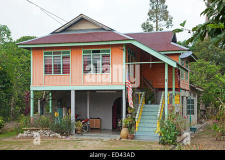 Modern Malaysian wooden house on pillars in the countryside near Taiping, Perak, Malaysia Stock Photo