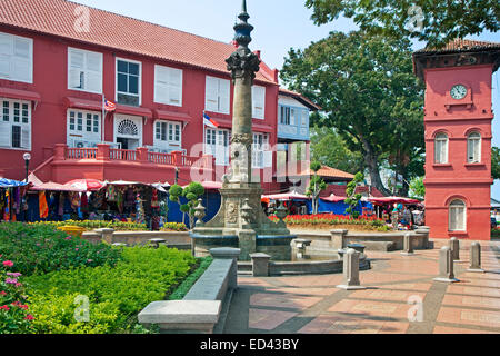 Red Square with fountain and clock tower in front of the Dutch Stadthuys, old colonial city hall in Malacca City, Malaysia Stock Photo