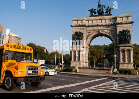 A school bus in Grand Army Plaza. NYC. Grand Army Plaza comprises the northern corner and the main entrance of Prospect Park in Stock Photo