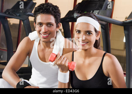 indian sports Trainer and lady Dumbbell Exercise Stock Photo