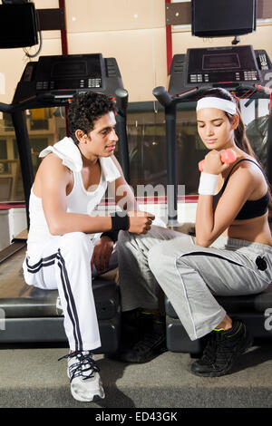 indian sports Trainer and lady Dumbbell Exercise Stock Photo