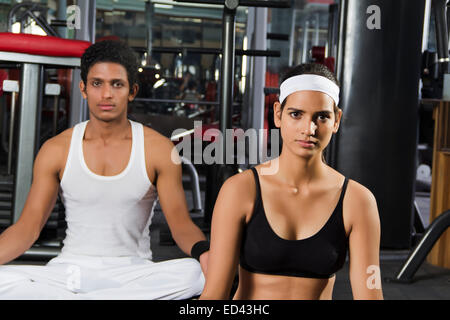 2 indian sports man and lady yoga Stock Photo