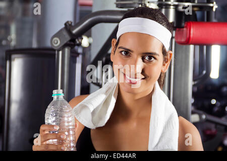 1 indian Sports lady gym Drinking water Stock Photo