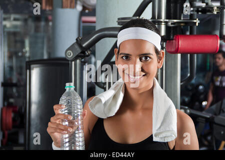 1 indian Sports lady gym Drinking water Stock Photo