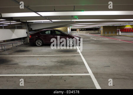 Almost empty multistory car park in Bristol, With a single parked car. 9th December 2014 Stock Photo