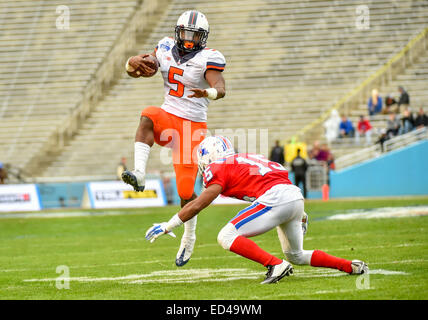 Dallas, Texas, USA. 26th Dec, 2014. Illinois Fighting Illini running back Donovonn Young (5) hurdles over Louisiana Tech Bulldogs cornerback Bryson Abraham (15) at the Zaxby's Heart of Dallas Bowl game between the Illinois Fighting Illini and Louisiana Tech Bulldogs December 26, 2014, during the first half at the Cotton Bowl in Dallas, Texas. Credit:  Cal Sport Media/Alamy Live News Stock Photo