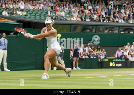 01.07.2014. The Wimbledon Tennis Championships 2014 held at The All England Lawn Tennis and Croquet Club, London, England, UK. Angelique Kerber (GER) [9] (red NCP logo) v Maria Sharapova (RUS) [5] on Centre Court. Angelique in action. Stock Photo