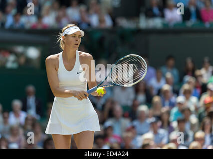 01.07.2014. The Wimbledon Tennis Championships 2014 held at The All England Lawn Tennis and Croquet Club, London, England, UK. Angelique Kerber (GER) [9] (red NCP logo) v Maria Sharapova (RUS) [5] on Centre Court. Maria in action. Stock Photo