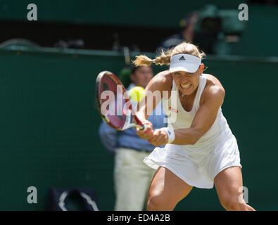 01.07.2014. The Wimbledon Tennis Championships 2014 held at The All England Lawn Tennis and Croquet Club, London, England, UK. Angelique Kerber (GER) [9] (red NCP logo) v Maria Sharapova (RUS) [5] on Centre Court. Angelique in action. Stock Photo