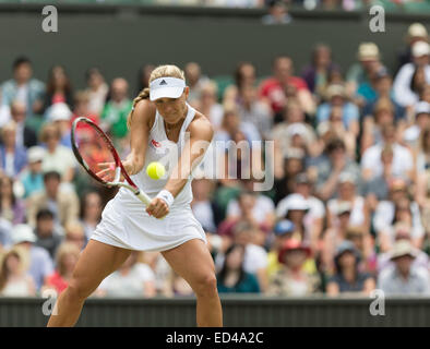 01.07.2014. The Wimbledon Tennis Championships 2014 held at The All England Lawn Tennis and Croquet Club, London, England, UK. Angelique Kerber (GER) [9] (red NCP logo) v Maria Sharapova (RUS) [5] on Centre Court. Angelique in action. Stock Photo