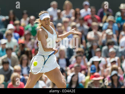 01.07.2014. The Wimbledon Tennis Championships 2014 held at The All England Lawn Tennis and Croquet Club, London, England, UK. Angelique Kerber (GER) [9] (red NCP logo) v Maria Sharapova (RUS) [5] on Centre Court. Maria in action. Stock Photo