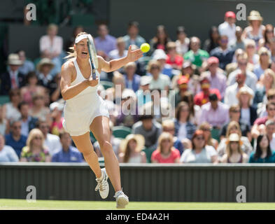 01.07.2014. The Wimbledon Tennis Championships 2014 held at The All England Lawn Tennis and Croquet Club, London, England, UK. Angelique Kerber (GER) [9] (red NCP logo) v Maria Sharapova (RUS) [5] on Centre Court. Maria in action. Stock Photo