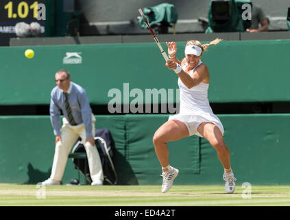 01.07.2014. The Wimbledon Tennis Championships 2014 held at The All England Lawn Tennis and Croquet Club, London, England, UK. Angelique Kerber (GER) [9] (red NCP logo) v Maria Sharapova (RUS) [5] on Centre Court. Angelique in action. Stock Photo