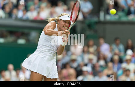 01.07.2014. The Wimbledon Tennis Championships 2014 held at The All England Lawn Tennis and Croquet Club, London, England, UK. Angelique Kerber (GER) [9] (red NCP logo) v Maria Sharapova (RUS) [5] on Centre Court. Angelique in action. Stock Photo