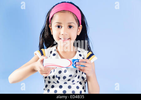 1 indian child girl showing Tooth Paste Stock Photo