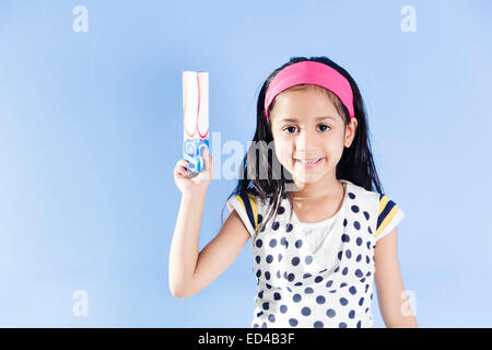 1 indian child girl showing Tooth Paste Stock Photo