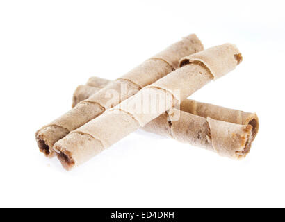 Striped wafer rolls filled with chocolate isolated on white Stock Photo