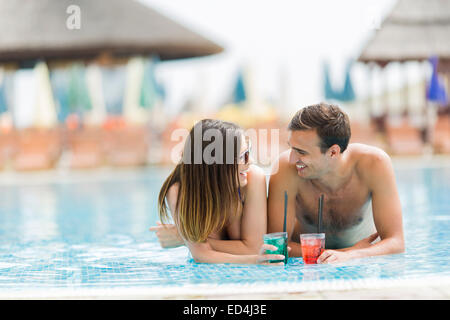 Young couple by the pool Stock Photo
