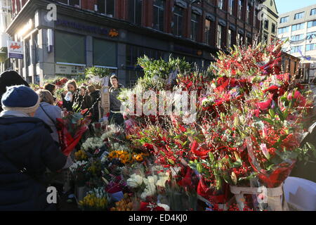 Image of flower stalls on Grafton Street in Dublin city centre as trade booms in the run up to Christmas. Stock Photo