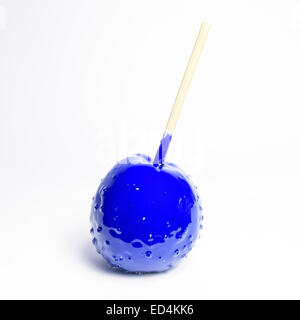 toffee apple blue on white background (isolated) Stock Photo