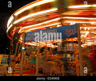 Traditional fairground attractions, Carousel, at Night at Edinburgh's Hogmanay, Scotland , UK Stock Photo