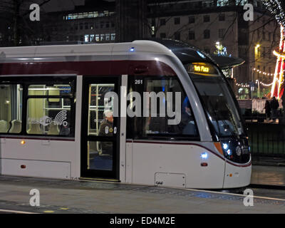 Front of New Edinburgh Tram bound for York Place, in St Andrew Square at night, Scotland, UK Stock Photo