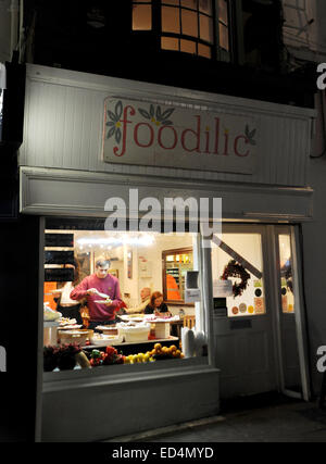 Brighton UK - The Foodilic Cafe restaurant with man using the buffet food bar in window Stock Photo