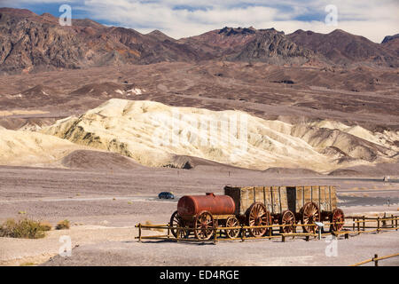 An old wagon train at the Harmony Borax works in Death Valley which is the lowest, hottest, driest place in the USA, with an average annual rainfall of around 2 inches, some years it does not receive any rain at all. Stock Photo