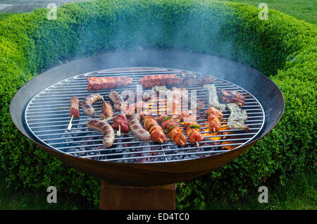 Big barbecue grill featuring various kinds of meat Stock Photo