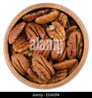Bowl With Pecans. Pecan halves in a wooden bowl from above, isolated on white background. Stock Photo